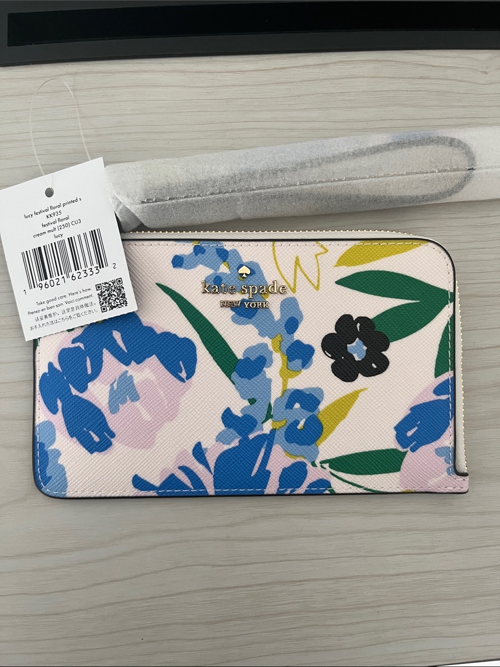 kate spade floral zip-around wallet in pink, blue, green and yellow